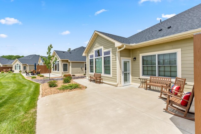 7466 Fairway Ln, Breezy Point, MN 56472 - back of property with a patio, a lawn, and roof with shingles