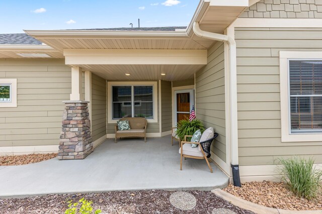 7466 Fairway Ln, Breezy Point, MN 56472 - entrance to property featuring a shingled roof and a patio