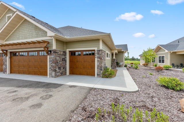 7466 Fairway Ln, Breezy Point, MN 56472 - view of front of house with stone siding, an attached garage, driveway, and a shingled roof