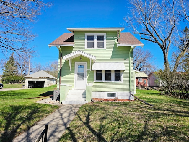 822 4th Ave, Madison, MN 56256 - view of front of house with an outdoor structure, a garage, roof with shingles, and a front yard