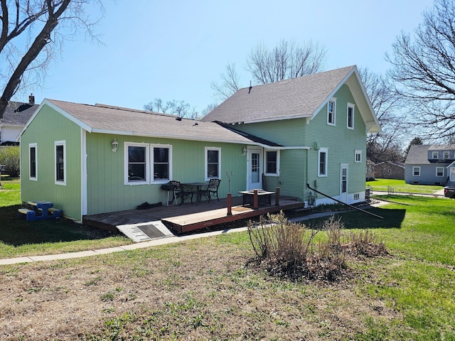 822 4th Ave, Madison, MN 56256 - rear view of property with a wooden deck, a shingled roof, and a yard