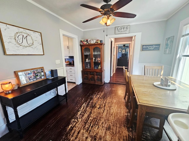 822 4th Ave, Madison, MN 56256 - dining room featuring ornamental molding, a ceiling fan, and wood finished floors