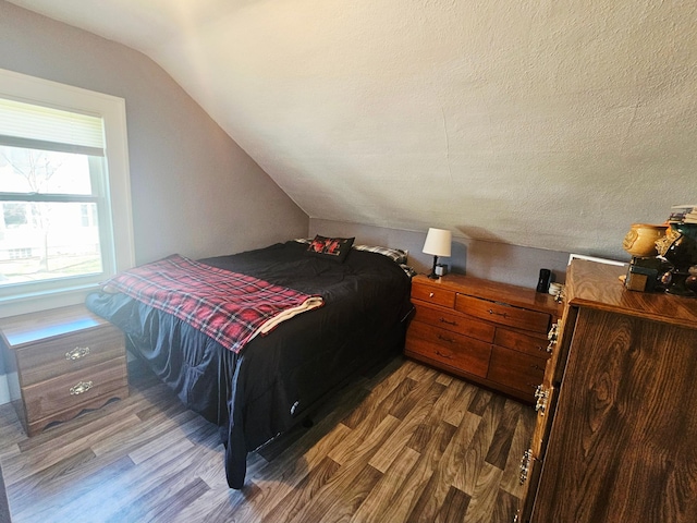 822 4th Ave, Madison, MN 56256 - bedroom featuring wood finished floors and lofted ceiling