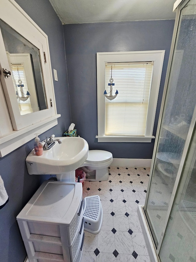 822 4th Ave, Madison, MN 56256 - full bath featuring tile patterned floors, plenty of natural light, a sink, and a stall shower