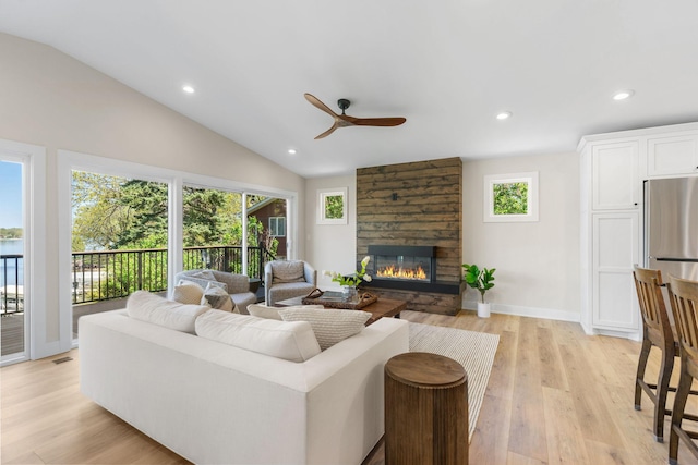 3124 Linden Cir NW, Prior Lake, MN 55372 - living area featuring a ceiling fan, a fireplace, light wood-type flooring, recessed lighting, and lofted ceiling