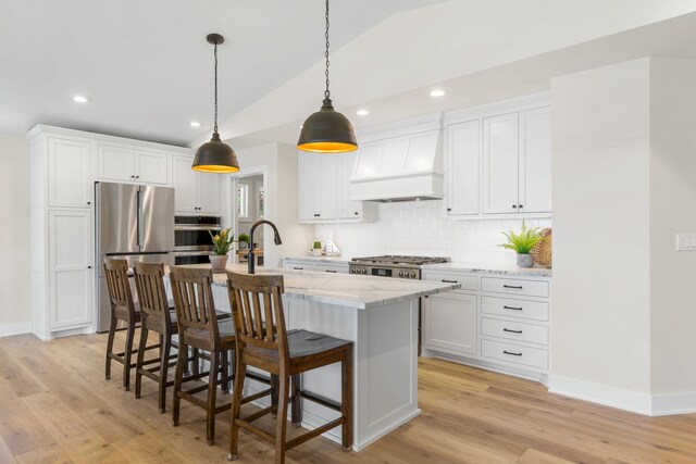 3124 Linden Cir NW, Prior Lake, MN 55372 - kitchen featuring appliances with stainless steel finishes, custom exhaust hood, lofted ceiling, a sink, and recessed lighting