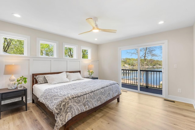 3124 Linden Cir NW, Prior Lake, MN 55372 - bedroom with access to exterior, a water view, light wood-style flooring, recessed lighting, and ceiling fan