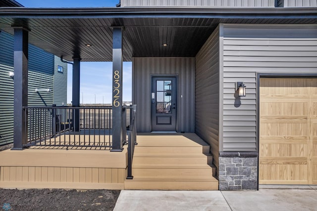 view of exterior entry featuring a porch