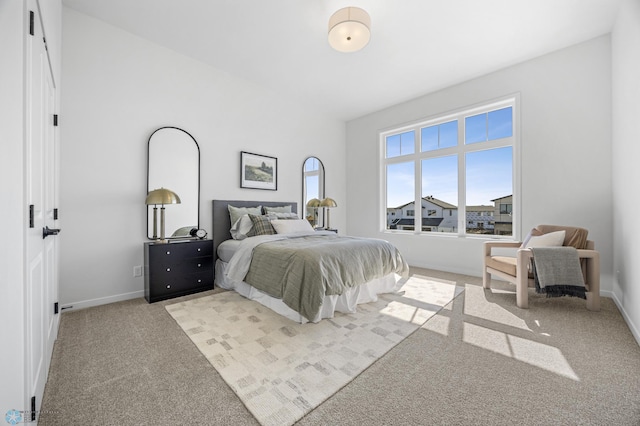 carpeted bedroom with baseboards