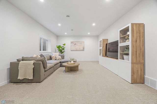 living room with carpet floors, recessed lighting, and visible vents