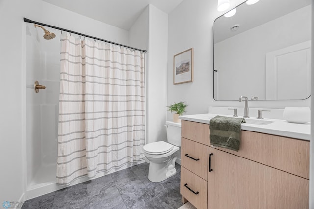 bathroom featuring toilet, curtained shower, and vanity