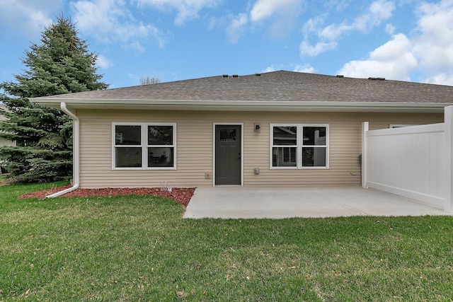 215 Butler St, Litchfield, MN 55355 - rear view of house with a patio area and a shingled roof