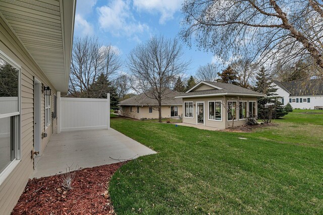 215 Butler St, Litchfield, MN 55355 - view of grassy yard with a patio area