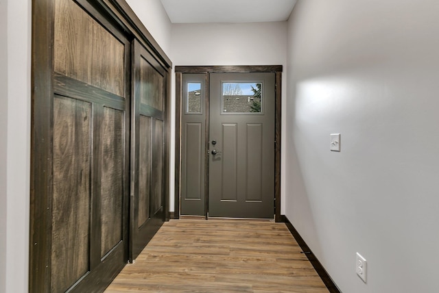 215 Butler St, Litchfield, MN 55355 - entryway featuring light wood-type flooring and baseboards