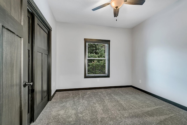 215 Butler St, Litchfield, MN 55355 - unfurnished bedroom featuring carpet and a ceiling fan