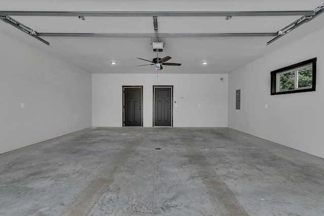 215 Butler St, Litchfield, MN 55355 - garage featuring electric panel, a garage door opener, a ceiling fan, and recessed lighting
