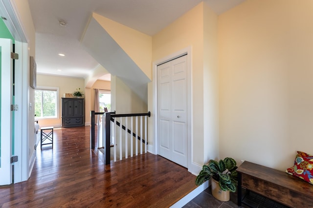 19717 Hazel Nut Ave, Lakeville, MN 55044 - hallway featuring an upstairs landing, arched walkways, wood finished floors, baseboards, and recessed lighting