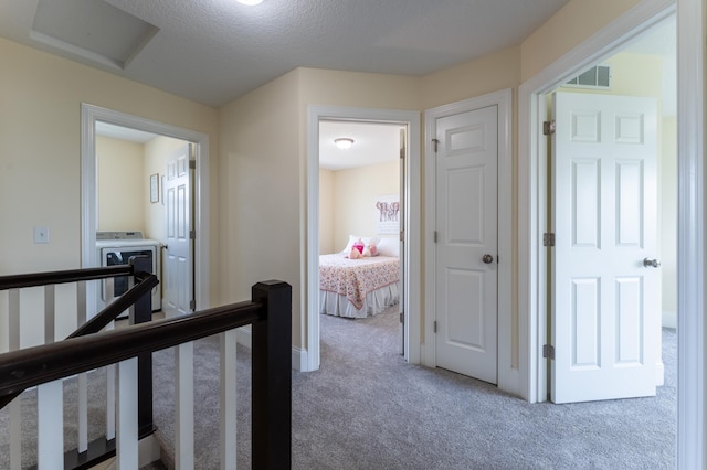 19717 Hazel Nut Ave, Lakeville, MN 55044 - corridor featuring carpet flooring, an upstairs landing, washer / dryer, and baseboards