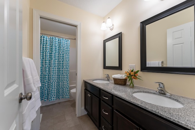 19717 Hazel Nut Ave, Lakeville, MN 55044 - bathroom with double vanity, toilet, tile patterned floors, and shower / bath combo