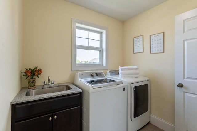 19717 Hazel Nut Ave, Lakeville, MN 55044 - washroom featuring washing machine and clothes dryer, cabinet space, and light tile patterned floors