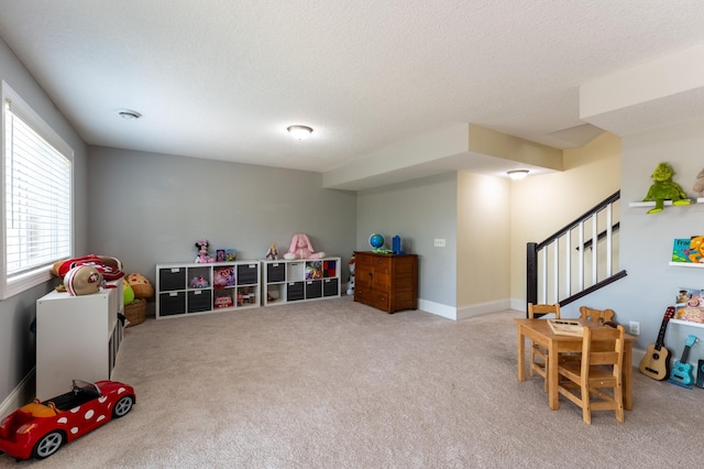 19717 Hazel Nut Ave, Lakeville, MN 55044 - rec room featuring carpet floors, a textured ceiling, and baseboards