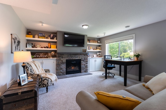 19717 Hazel Nut Ave, Lakeville, MN 55044 - living room with light carpet, a stone fireplace, a desk, and baseboards