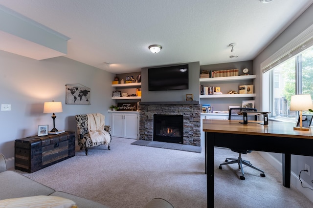19717 Hazel Nut Ave, Lakeville, MN 55044 - home office with carpet, a fireplace, baseboards, and a textured ceiling