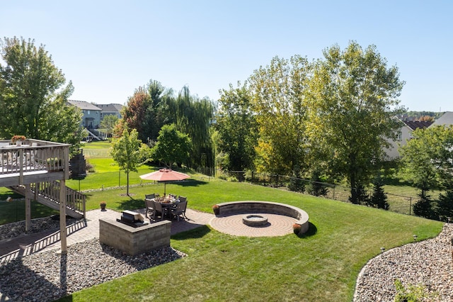 19717 Hazel Nut Ave, Lakeville, MN 55044 - view of yard featuring an outdoor fire pit, a deck, and a patio