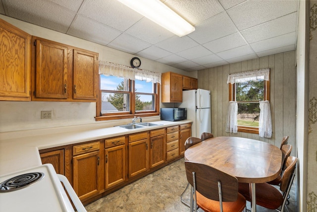 37301 Little Sweden Rd, Nashwauk Twp, MN 55769 - kitchen featuring a sink, black microwave, a paneled ceiling, and brown cabinets