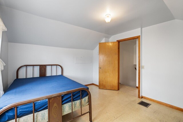 37301 Little Sweden Rd, Nashwauk Twp, MN 55769 - bedroom with lofted ceiling, baseboards, visible vents, and light colored carpet