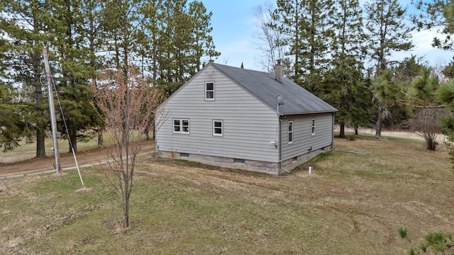 37301 Little Sweden Rd, Nashwauk Twp, MN 55769 - view of side of home featuring a shingled roof, crawl space, a chimney, and a lawn