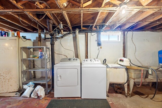 37301 Little Sweden Rd, Nashwauk Twp, MN 55769 - below grade area with washing machine and dryer and a sink