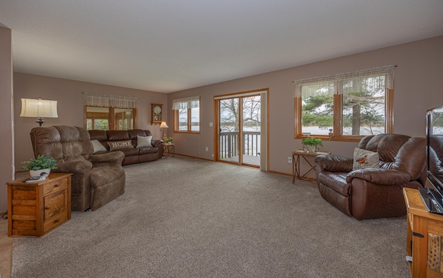 living room with plenty of natural light, carpet flooring, and baseboards