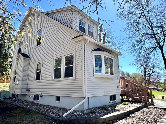 view of property exterior with stairway