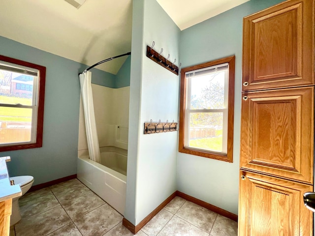 full bath featuring baseboards, shower / tub combo with curtain, tile patterned flooring, and toilet