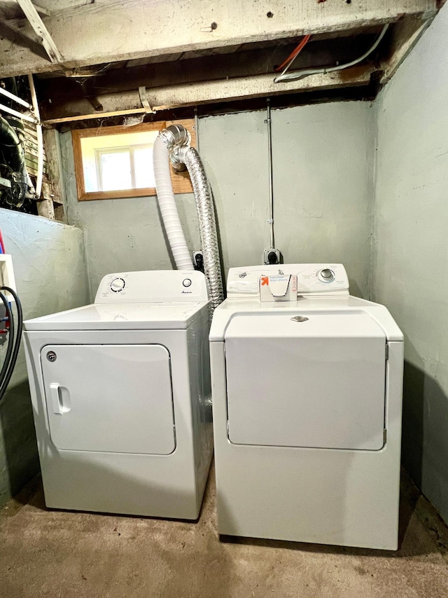 laundry room featuring separate washer and dryer and laundry area