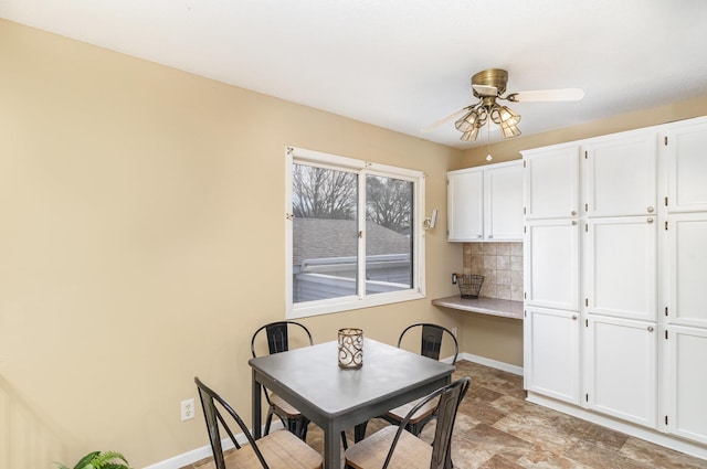 dining space featuring a ceiling fan