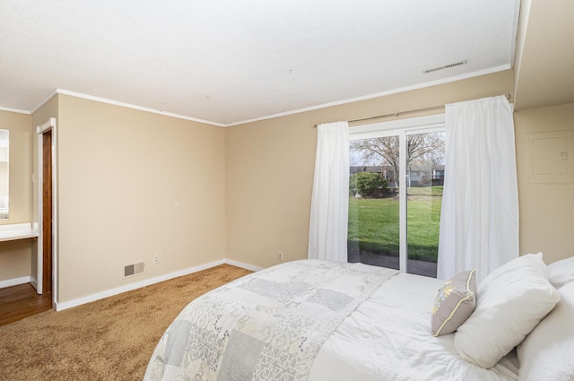 bedroom with baseboards, visible vents, ornamental molding, and carpet