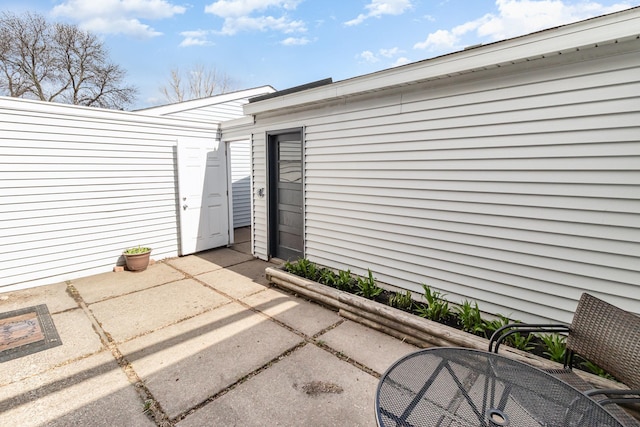 entrance to property with a patio