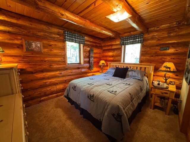 carpeted bedroom featuring wood ceiling, multiple windows, beamed ceiling, and log walls