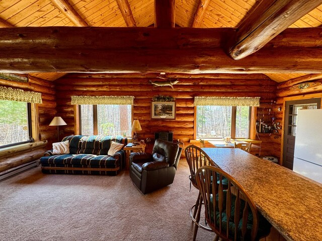 living area featuring carpet flooring, rustic walls, a wealth of natural light, and wood ceiling