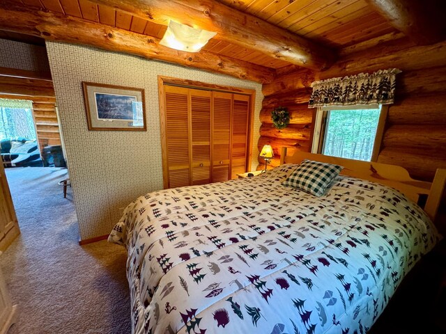 carpeted bedroom featuring log walls, wood ceiling, and multiple windows