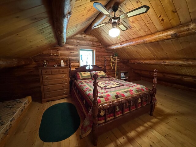 bedroom with light wood-style floors, log walls, vaulted ceiling with beams, and wood ceiling