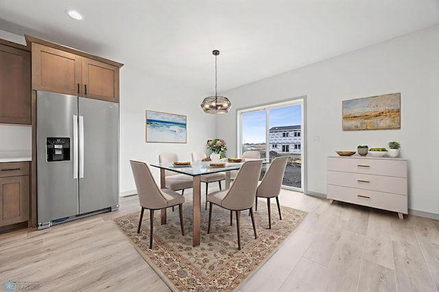 8343 61st St S, Horace, ND 58047 - dining area featuring light wood-style floors and a chandelier
