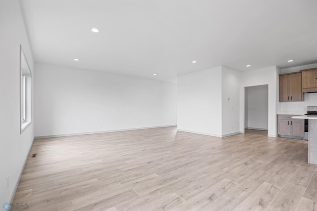 8343 61st St S, Horace, ND 58047 - unfurnished living room featuring light wood finished floors and recessed lighting