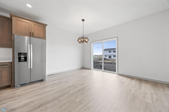 8343 61st St S, Horace, ND 58047 - kitchen featuring stainless steel fridge with ice dispenser, a chandelier, light wood-style floors, decorative light fixtures, and recessed lighting