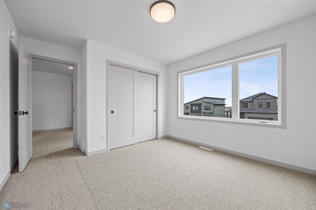 8343 61st St S, Horace, ND 58047 - unfurnished bedroom featuring carpet flooring and a closet