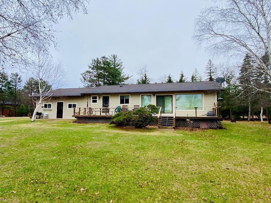 16118 Morningside Dr, Wascott, WI 54838 - view of front of property featuring a wooden deck and a front lawn