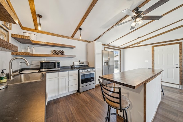 kitchen featuring open shelves, a sink, lofted ceiling with beams, butcher block counters, and stainless steel appliances