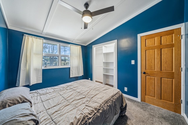 bedroom with a closet, baseboards, vaulted ceiling with beams, a ceiling fan, and carpet